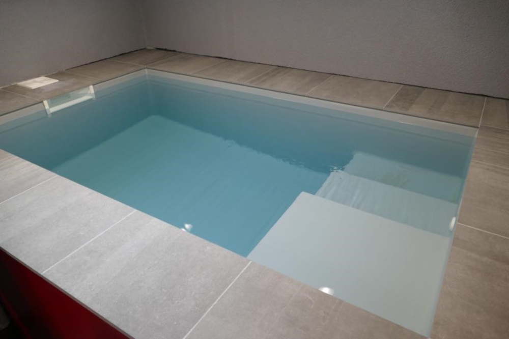 Piscine et tapis hydraulique